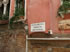 Street names, districts and directions are painted on the buildings in Venice.